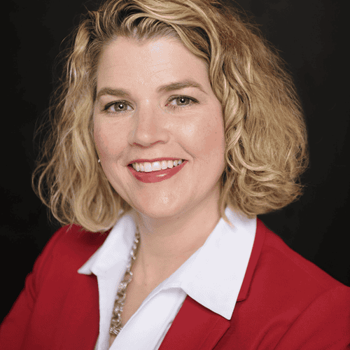 Kelley Kuhn headshot 2022 (red jacket)_sml